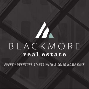 White Blackmore real estate logo on a texture background with tagline