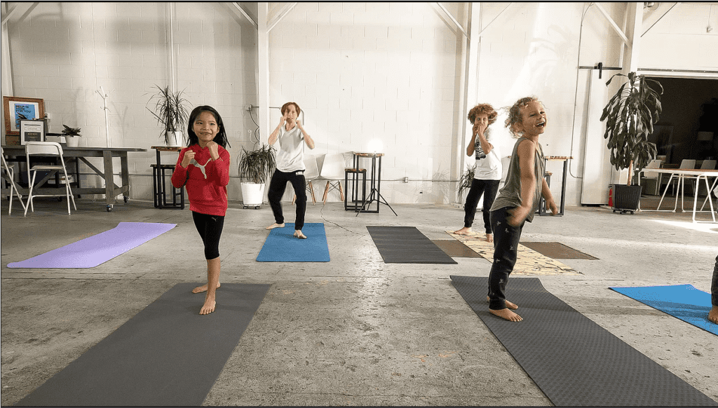 this yoga logo is meant to appeal to kids and teens