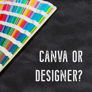 PANTONE book fanned open on a black background with the text "Canva or Designer?"