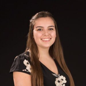 Sara Weisgerber, a young brunette smiling at camera