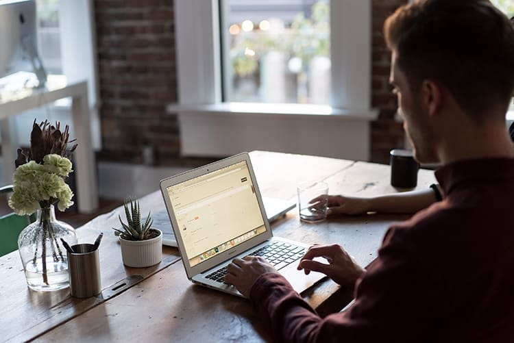 Young entrepreneur working at his laptop