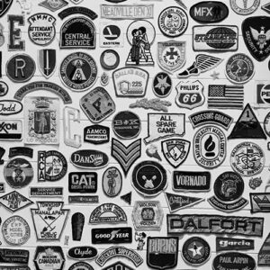 Black and white photo of dozens of fabric patches