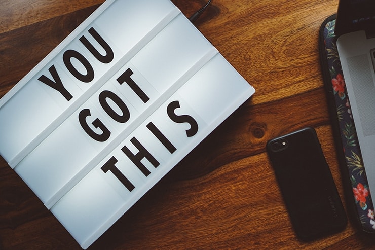 A small marquee sign reading "YOU GOT THIS" on a wooden desk