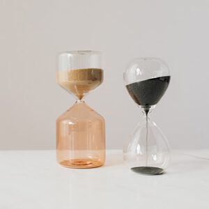 Minimalist photo of two hourglasses